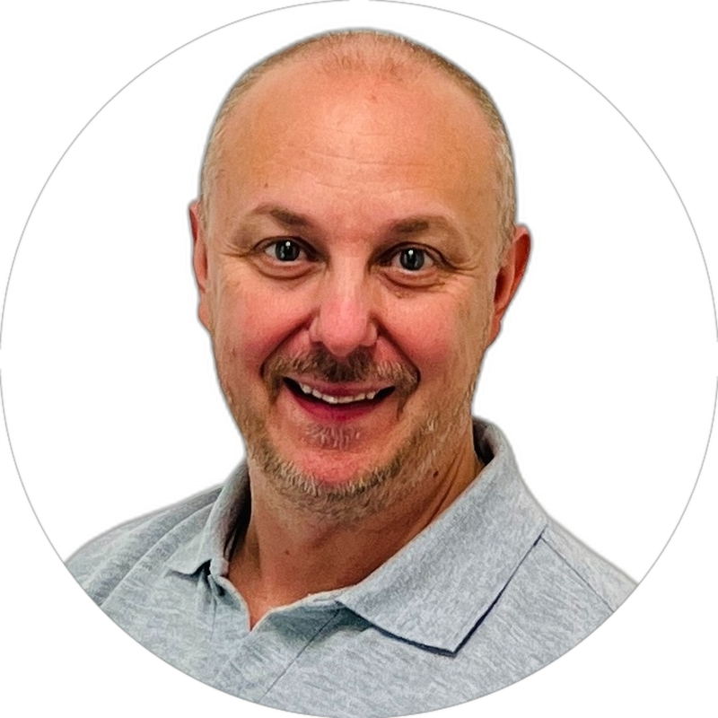 Brett Casterton, founder of Inology IT, smiling in a grey Inology polo shirt